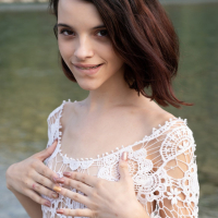 Shy young cutie Ohana Petite seductively reveals smooth skin by the river
