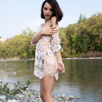Shy young cutie Ohana Petite seductively reveals smooth skin by the river
