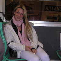 Cheerful blonde Shelby Bell posing in the streets of Paris