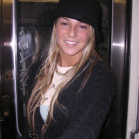 Cheerful blonde Shelby Bell posing in the streets of Paris