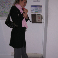 Cheerful blonde Shelby Bell posing in the streets of Paris