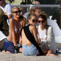 Paris Hilton showing her hard pokies in white transparent bikini top on the beac