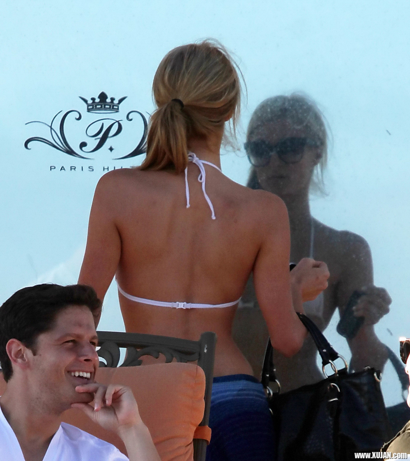 Paris Hilton showing her hard pokies in white transparent bikini top on the beac - Photo #1480151