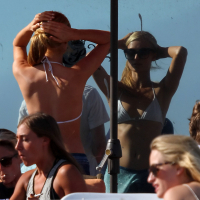 Paris Hilton showing her hard pokies in white transparent bikini top on the beac