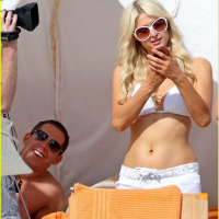Paris Hilton wearing sexy white bikini seethrough shorts at the beach in Cabo