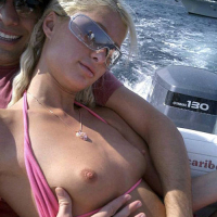 Paris Hilton showing her legs in white mini skirt