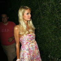 Paris Hilton posing sexy in white mini skirt