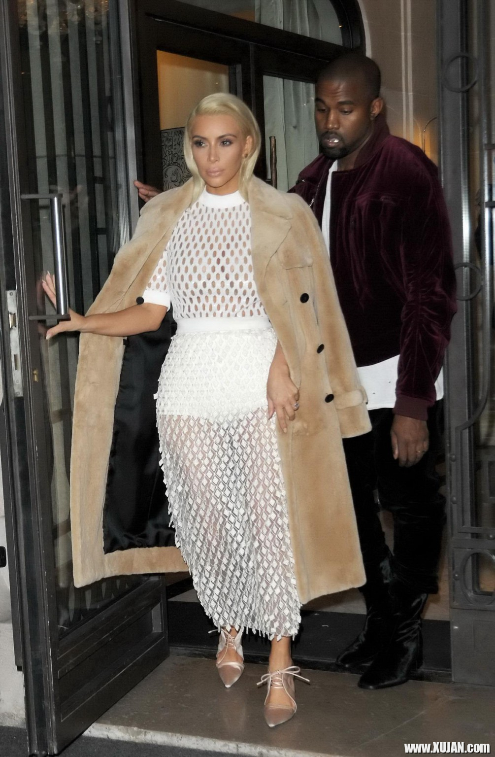 Kim Kardashian in a white mesh dress leaving her hotel in Paris - Photo #1480432