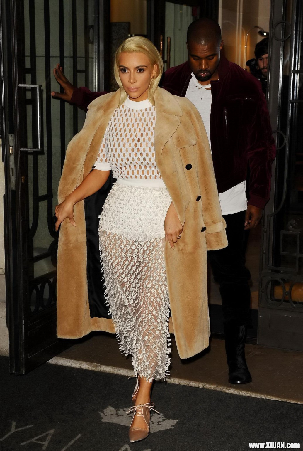Kim Kardashian in a white mesh dress leaving her hotel in Paris - Photo #1480437