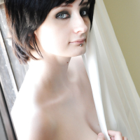 Tattooed brunette Violet Monroe smoking cigarette while flashing underwear