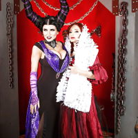 Cosplay lesbians Romi Rain and Violet Monroe kissing and posing