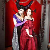 Cosplay lesbians Romi Rain and Violet Monroe kissing and posing