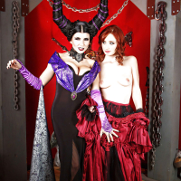 Cosplay lesbians Romi Rain and Violet Monroe kissing and posing