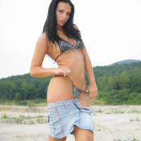 Mili Jay unties her sexy little bikini