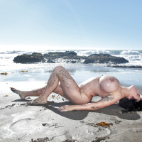 Beach babe and pornstar Leanne Crow flashing her massive tits