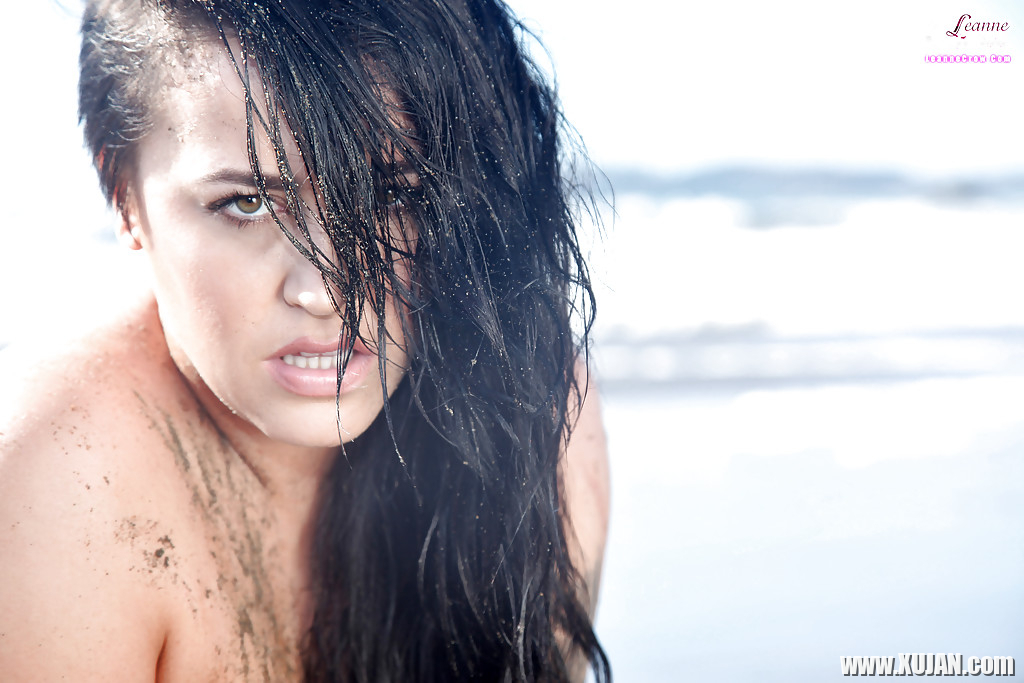 Chesty brunette pornstar Leanne Crow exposing huge hooters on the beach - Photo #1493989