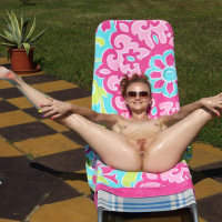 Smoking hot Lady Bug posing Naked by the Pool