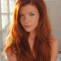 Redhead babe Mia Sollis revealing small teen tits and tight ass outdoors