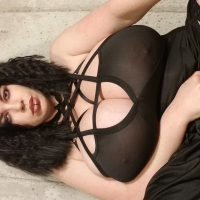 Lovely Lilith unveils her huge boobs while posing