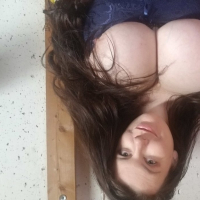 Lovely Lilith unveils her huge boobs while posing