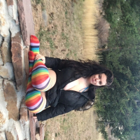Brunette chick Lovely Lilith teasing with her huge tits outdoors