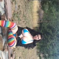 Brunette chick Lovely Lilith teasing with her huge tits outdoors