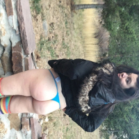 Brunette chick Lovely Lilith teasing with her huge tits outdoors