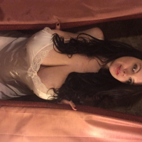 Brunette babe Lovely Lilith showing her big boobs