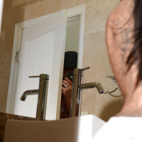 Tattooed brunette Lela Star is taking a hot bath absolutely naked
