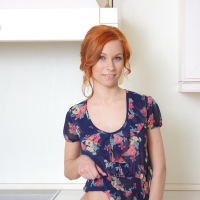 Sexy redhead Daisy Lee naked in only her black stockings