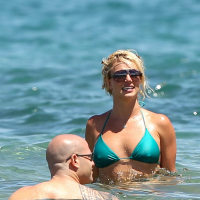 Britney Spears showing pokies in wet blue bikini on the beach in Maui