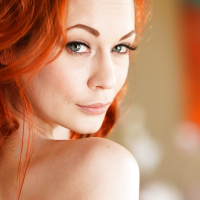 Seductive mature redhead Justine spreads her delicious butt cheeks