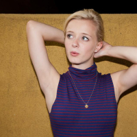 Blonde teen Kenze Thomas teases in her blue dress