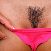 Lou Charmelle takes off shorts and undies to expose her sexy bush