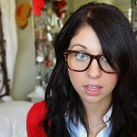Glasses on round face of cute girl Madelyn Monroe stress her tiny tits