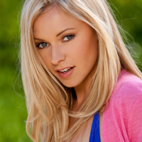 Lena Nicole smiles for the camera while posing at the pool