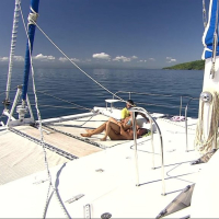 Busty double penetrated on the deck of a yacht