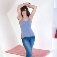 Mature woman Katie posing barefoot in denim jeans before getting naked