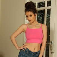 Katie pulls off her denim shorts before making her nipples hard