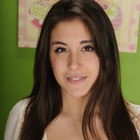 Amateur brunette Natalie Monroe gets undressed for that naked feeling