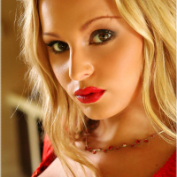 Blonde vixen Liliane Tiger plays with her pierced pussy