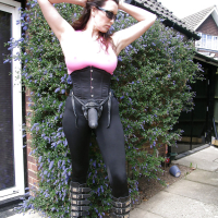Bigtitted babe Jane stripping with a huge strapon at the backyard