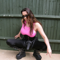 Bigtitted babe Jane stripping with a huge strapon at the backyard