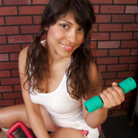 Sporty latina babe exposing her big melons and unshaven cooter