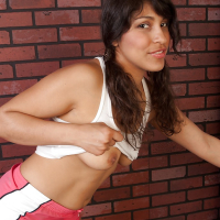 Sporty latina babe exposing her big melons and unshaven cooter