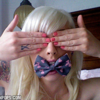 Blonde Lynn Pops shows off her Tatoos in various Pics
