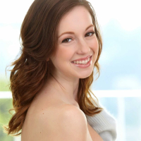 Victoria Voss shows off her silky white skin by the balcony