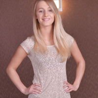 Tall blond solo model Tery posing non nude in denim jeans before undressing