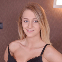Tall blond solo model Tery posing non nude in denim jeans before undressing