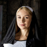 Blonde babe Sara Sloane strips off nuns uniform to expose big tits